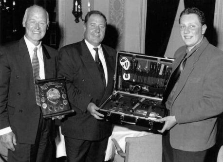 Phil Morgan (pictured far right) receiving the Apprentice of the Year Award with Eric Kimpton (left) looking on