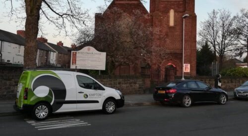 Christchurch in Wallasey with a Kimpton van parked outside