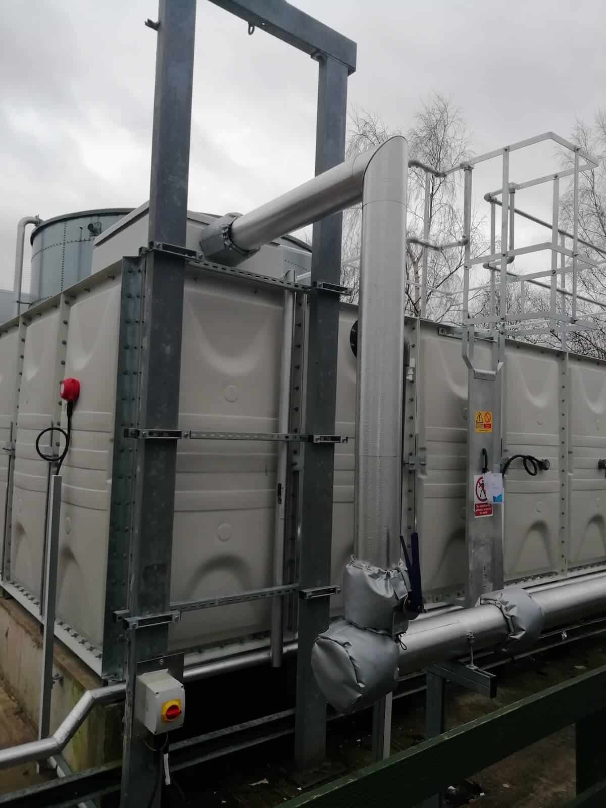 Water inlet at the top of the tank with an immersion heater on view to the left