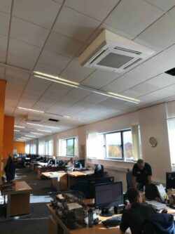The air conditioning installation in North Wales in an open plan office with a sloping ceiling