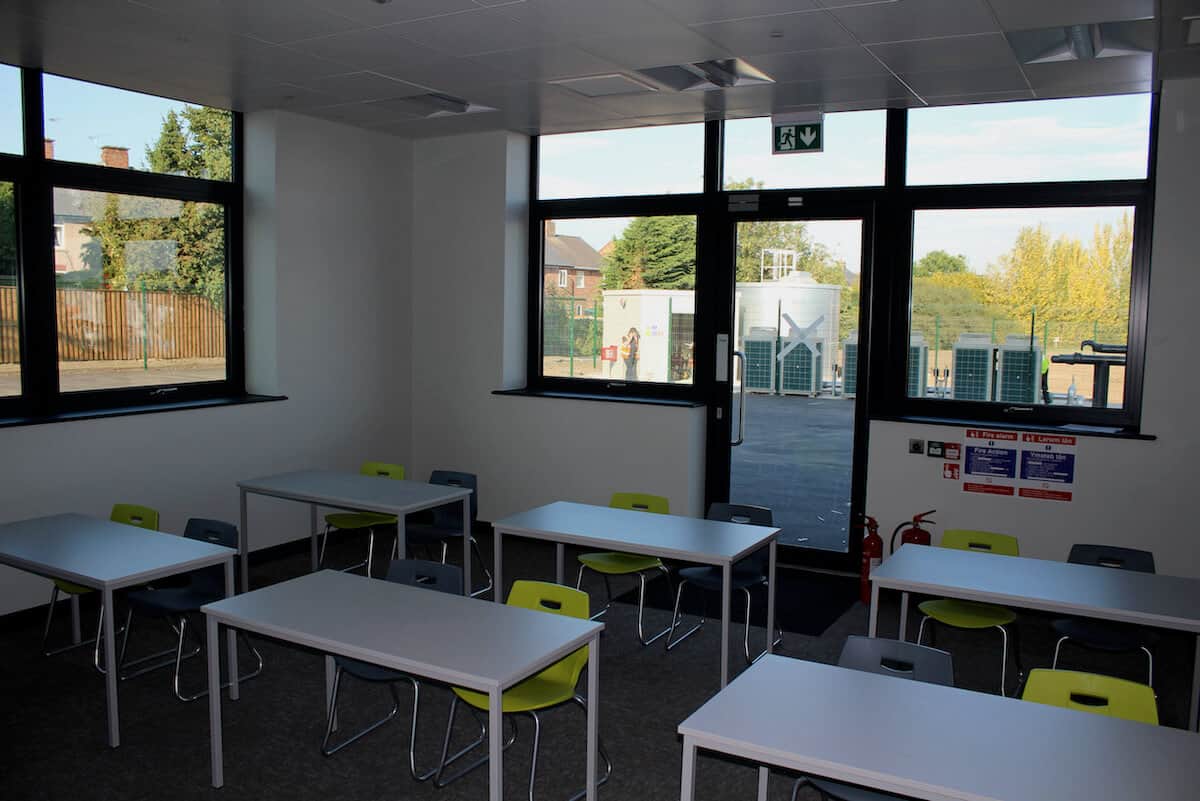 View across the classroom to the three Mitsubishi CAHV ASHP units at Queensferry PRU by Kimpton