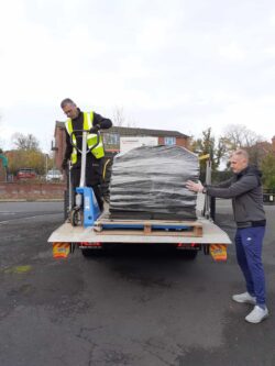 Offloading the reclaimed carpet tiles