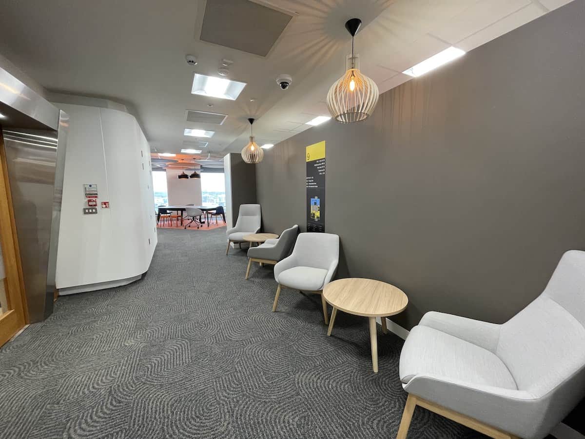 Arrival space on Capital Building floor 9 with new fire protection lighting and data by Kimpton