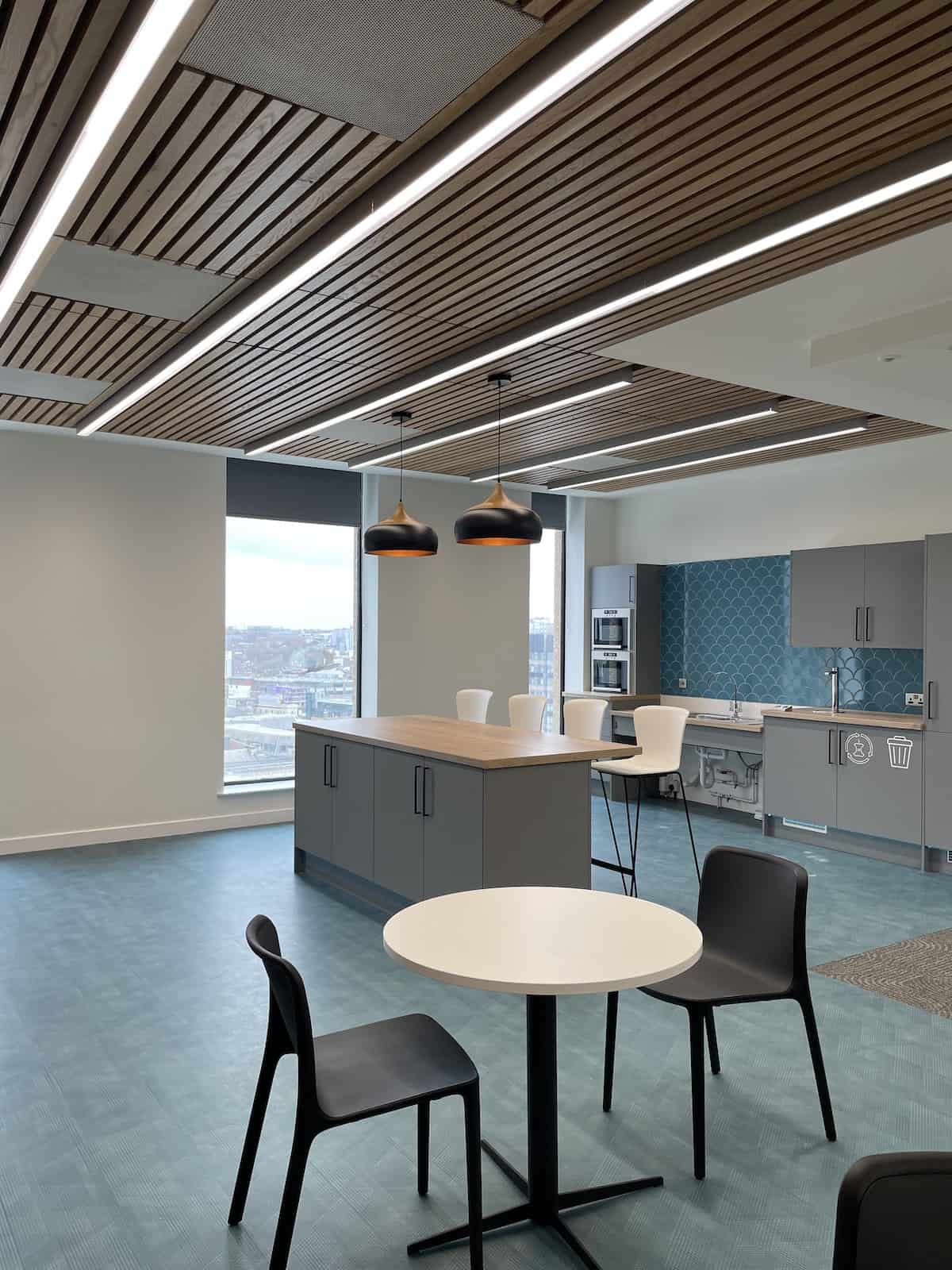 Kitchen and meeting space at Capital Building floor 9 by Kimpton