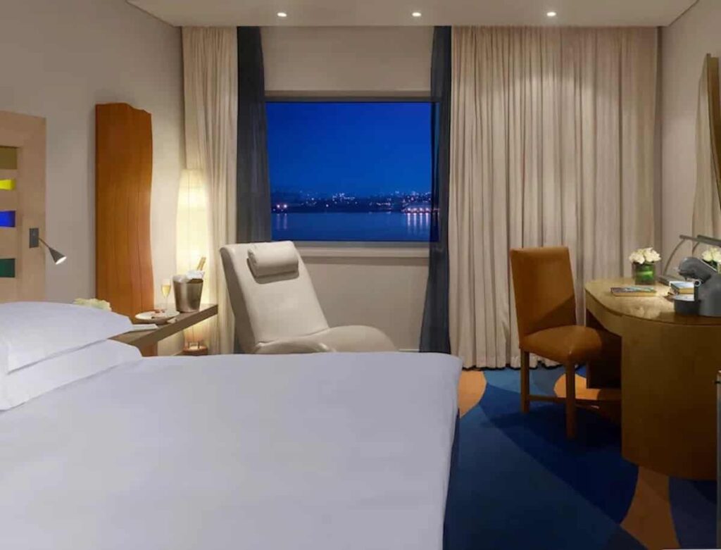 Bedroom with river view at Radisson Blu Liverpool with HVAC maintenance by Kimpton Wirral