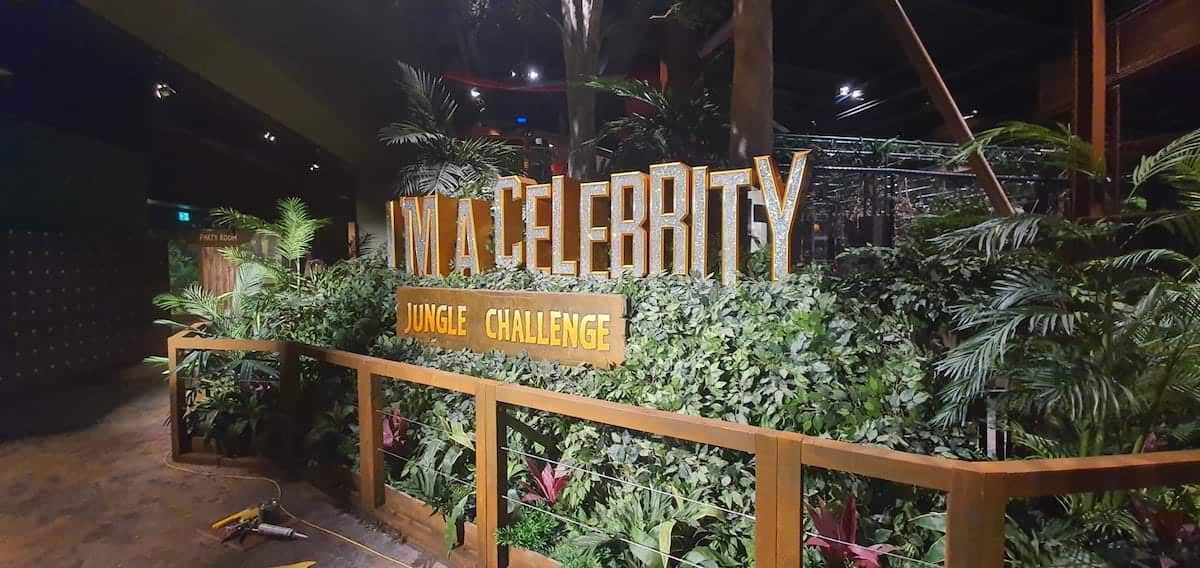 Main welcome sign at Im a Celebrity Jungle Challenge with plumbing by Kimpton
