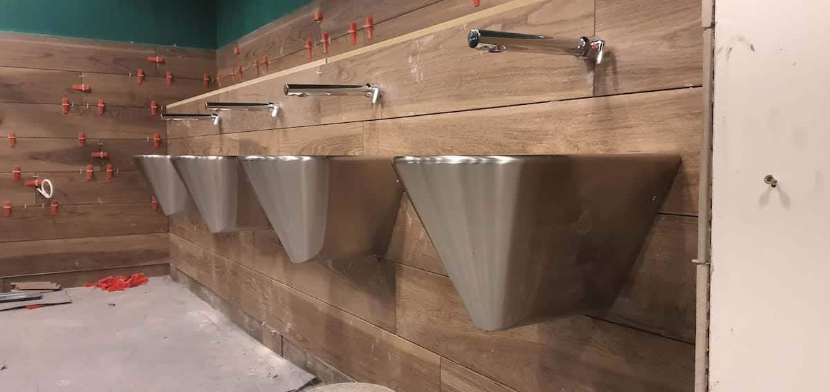 Sinks inside the ladies toilets at Im a Celebrity Jungle Challenge with plumbing by Kimpton