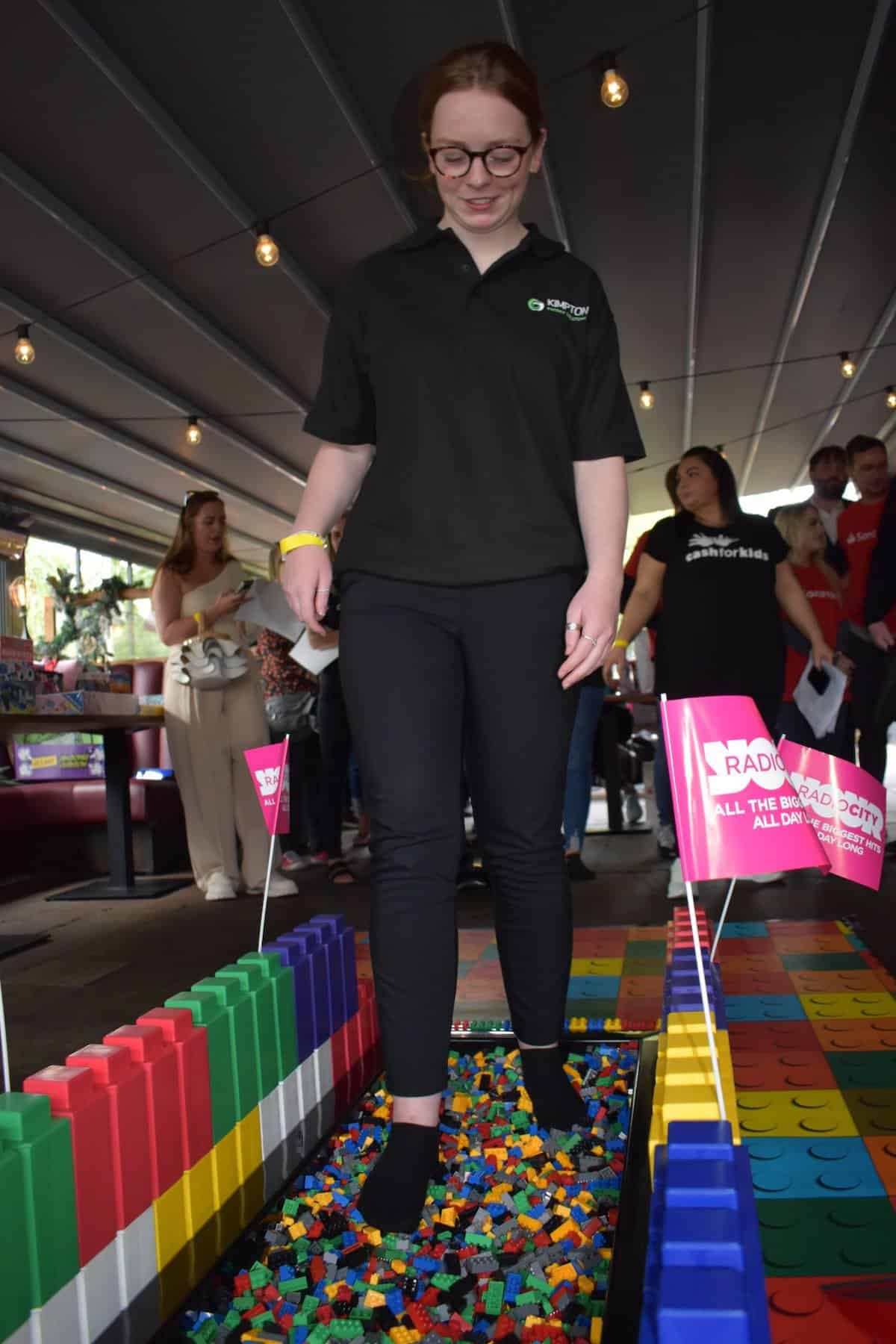 Grace Roberts completing the Lego Walk of Pain for Cash4Kids Kimpton CSR Liverpool