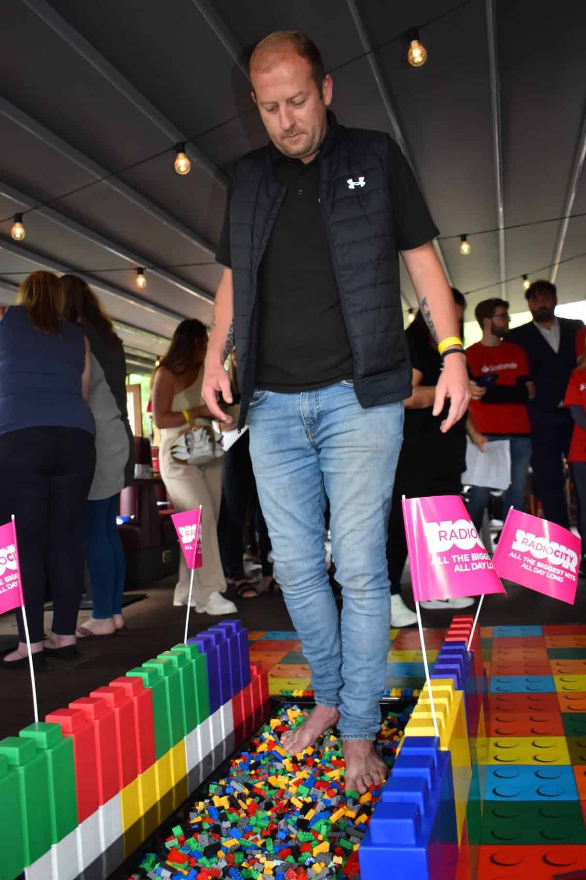 Steve Loughran part of the Kimpton CSR Liverpool team completes the Lego Walk of pain