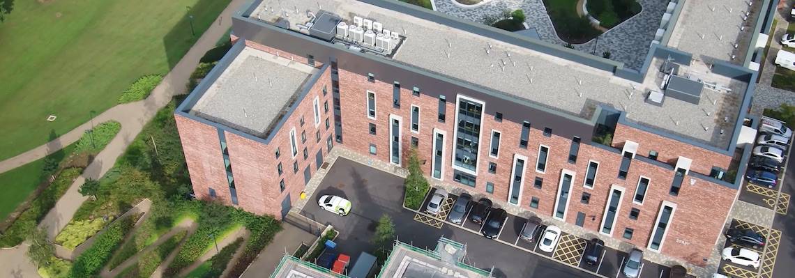 Looking down at Kimpton Service Engineer outside Greenbank House