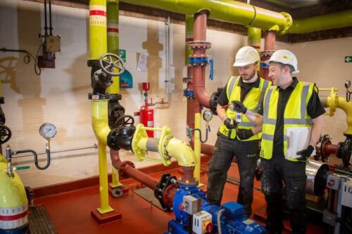 The Kimpton team on site where you can see the scale of pipework needed for commercial plumbing