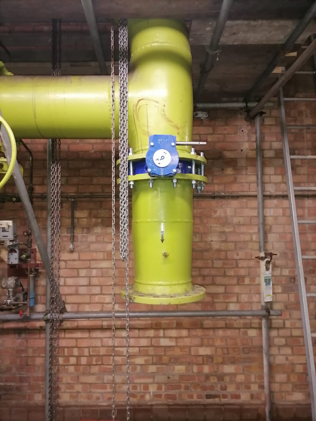 Another valve is removed after the pipe freezing is underway