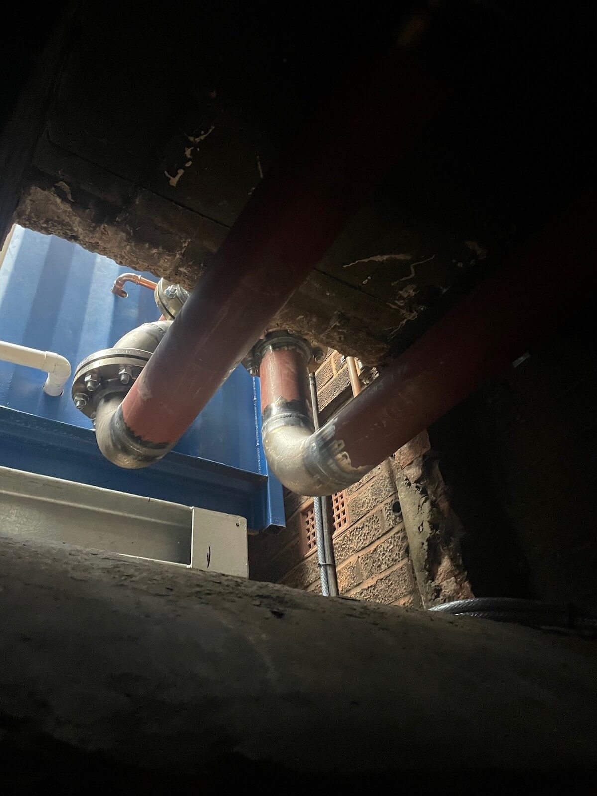 Connections from the new packaged plant room into the existing basement plant room