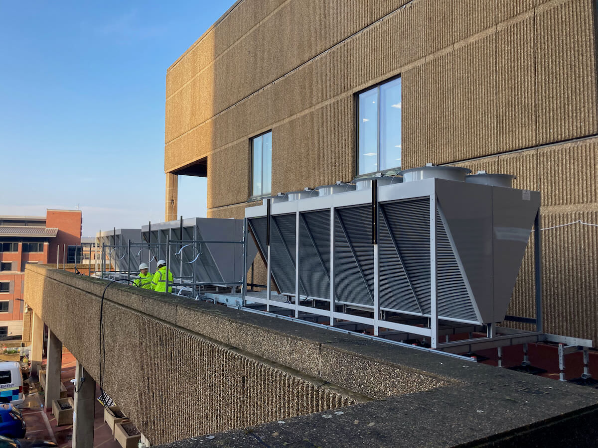 Working outside to install three new temporary dry air coolers