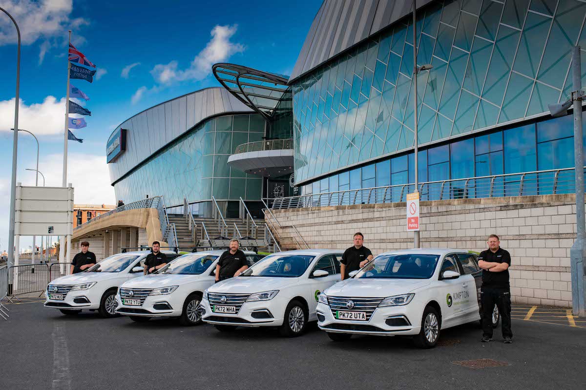 The Kimpton team in their electric vehicles outside the ACC Arena Liverpool