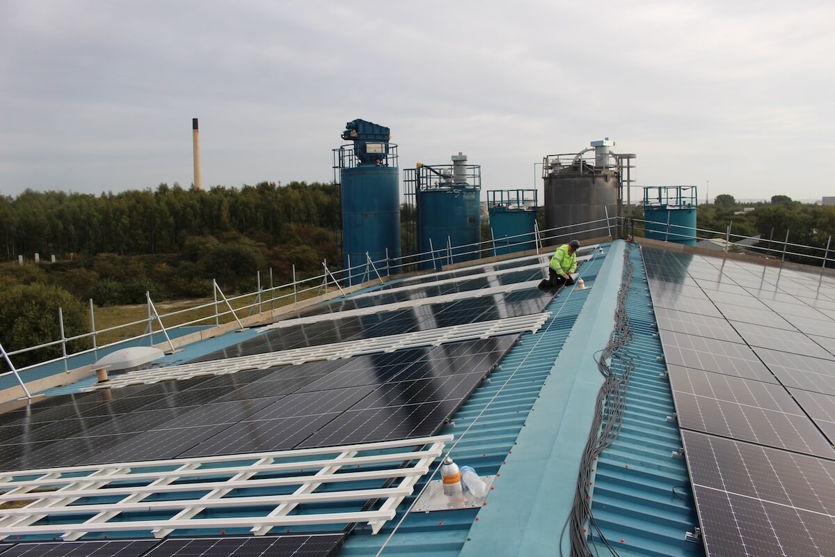 Engineer on the roof of the Solar PV installation at Hitex by Kimpton
