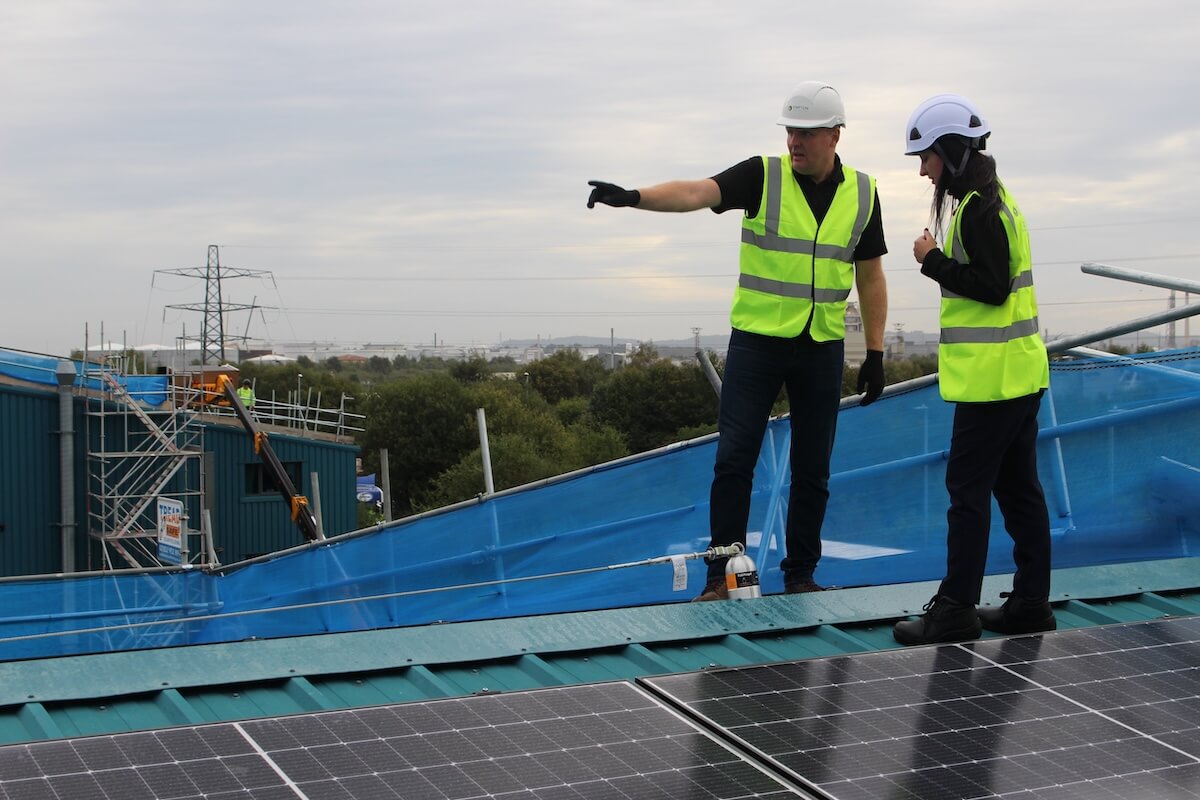 Graham and Oksana on the roof of Solar PV installation at Hitex by Kimpton