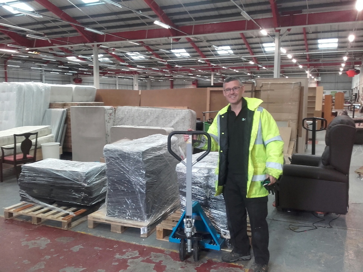 Lee Williams of Kimpton delivering reclaimed carpet tiles