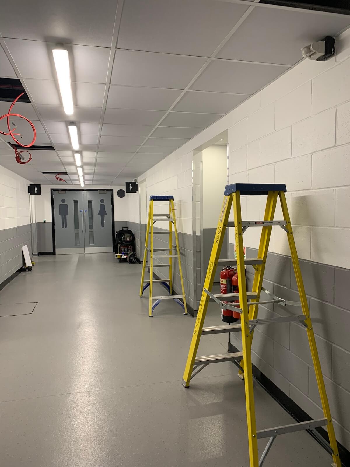 The new ceiling with lighting and the new toilets at the end of the character