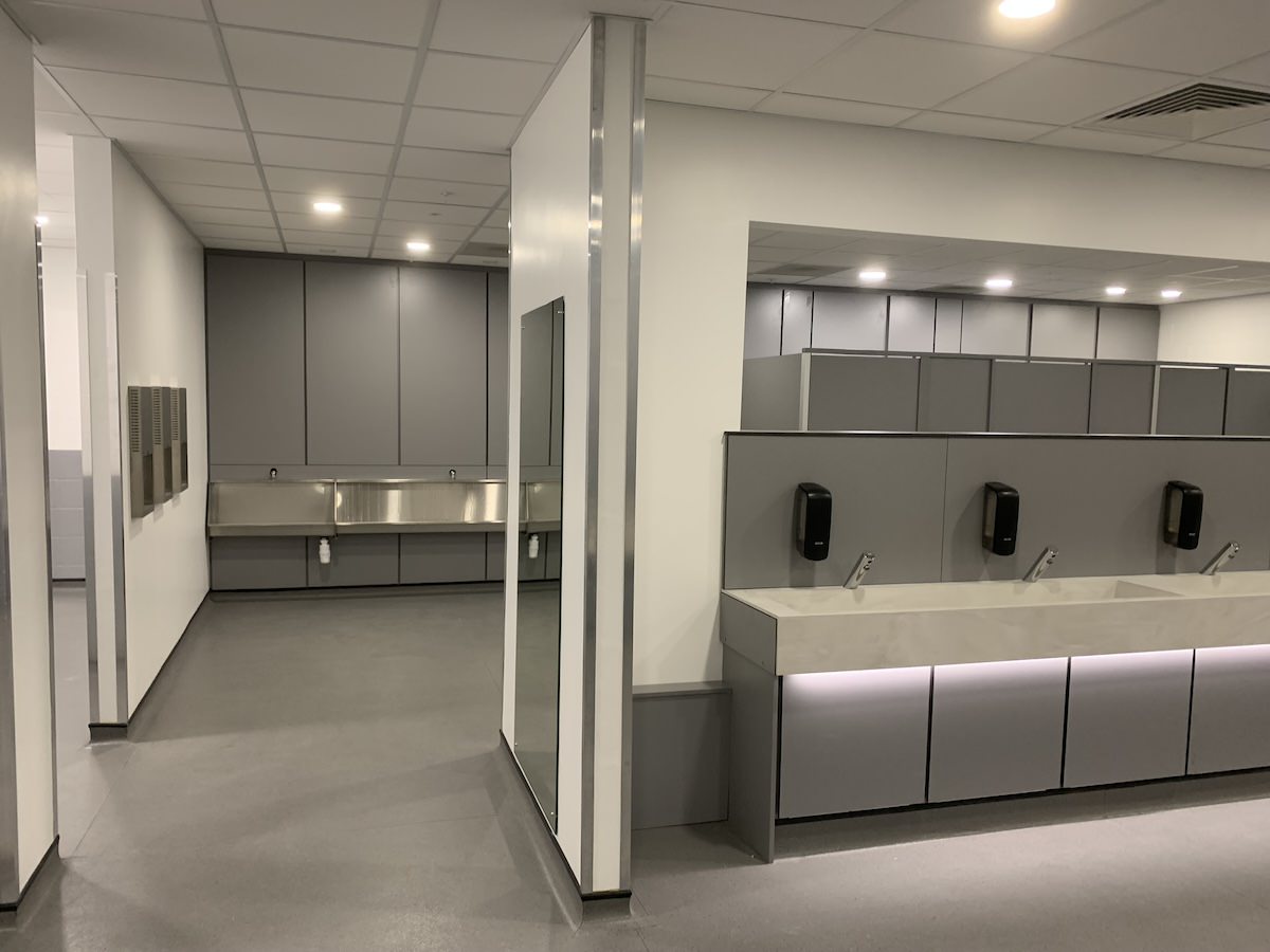 Urinals hand wash and driers inside the gents public toilets at ACC Arena