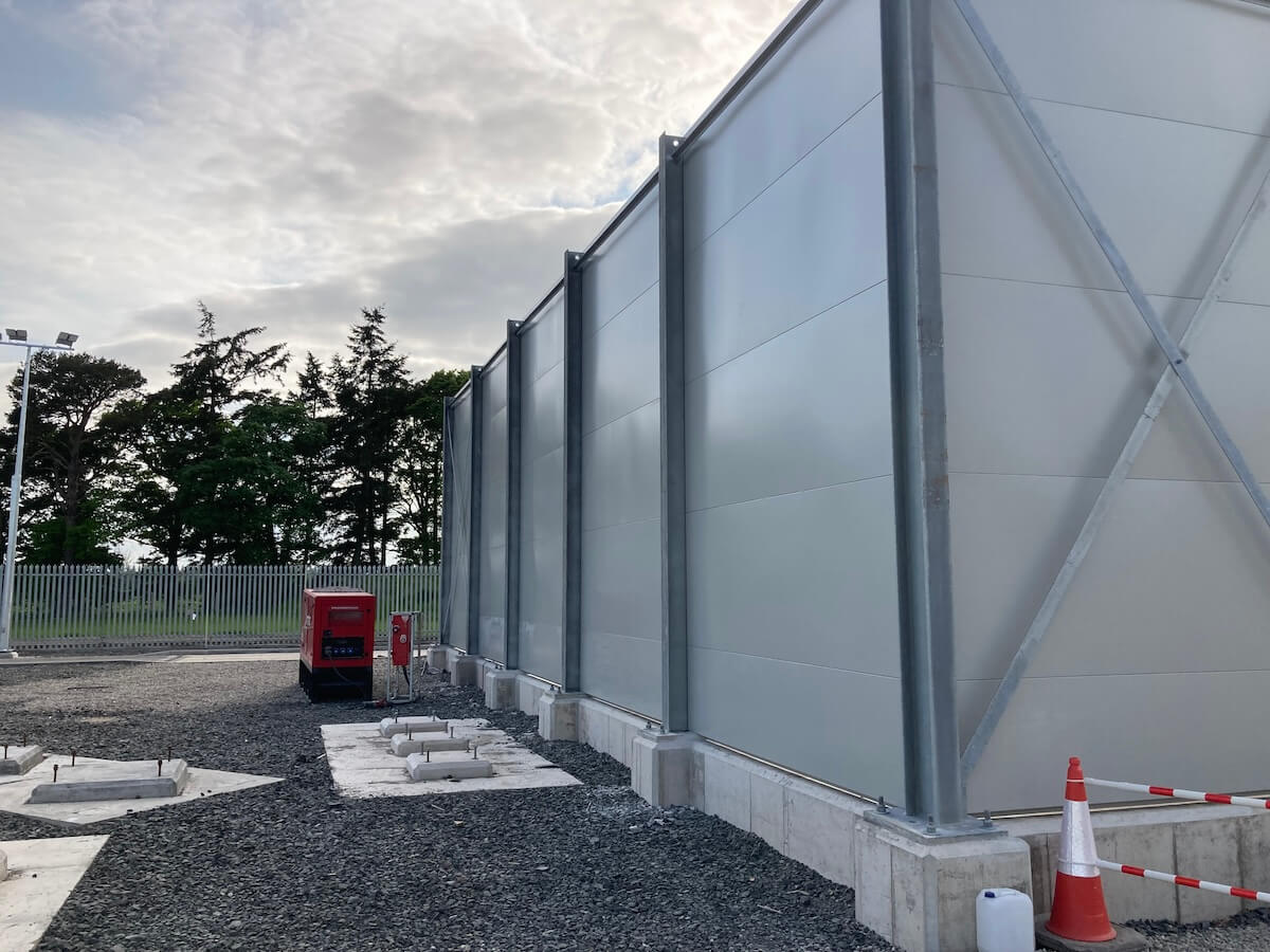 Along the exterior wall of Alyth Substation Acoustic Screen