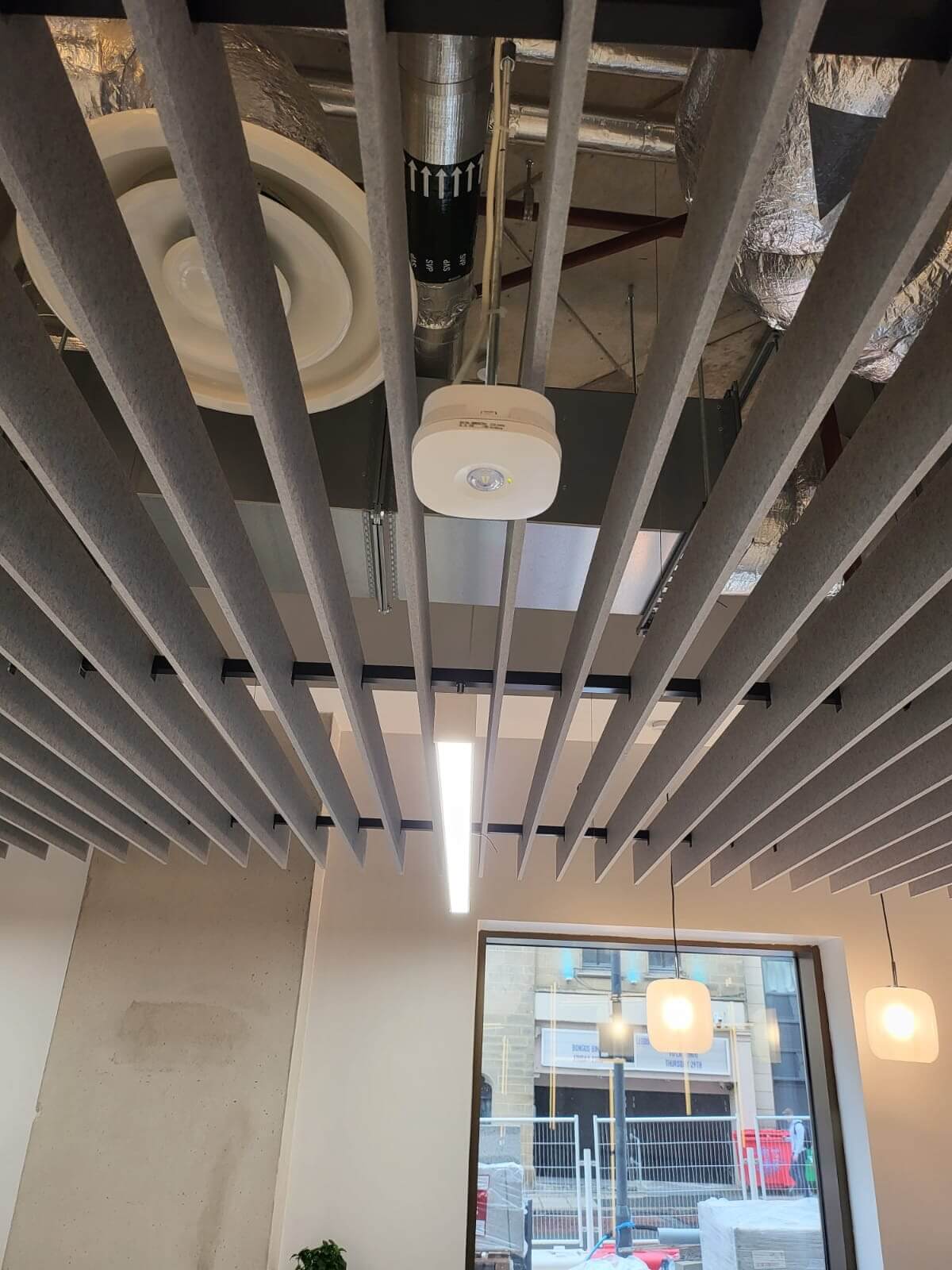 A Fire Sprinkler system and fire detection as part of a fire alarm system alongside Decorative LED rope lighting over desk as common area feature