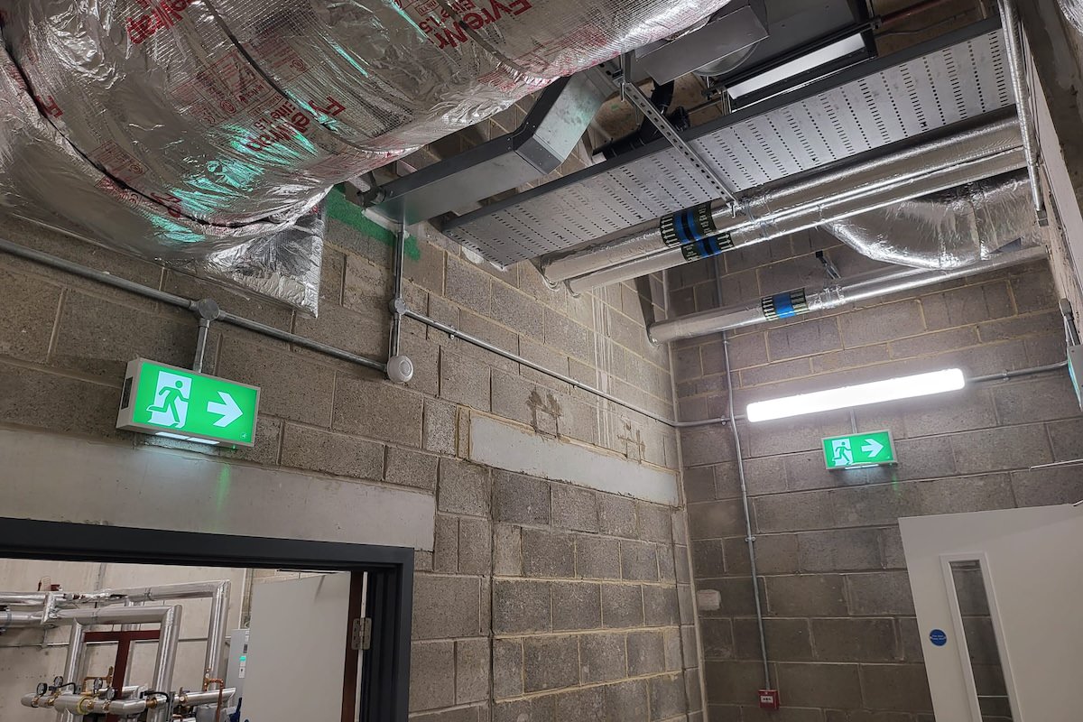 Emergency Lighting by Kimpton with running man signs illuminated