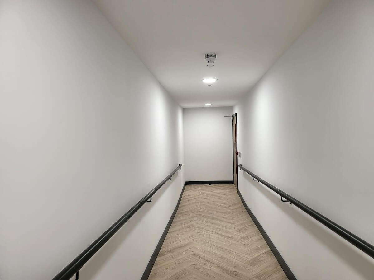 Emergency lighting with fire alarm detection
