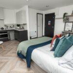 PBSA and BTR refurbishment - Studio bedroom with kitchen at Steelworks Sheffield PBSA with mechanical services by Kimpton