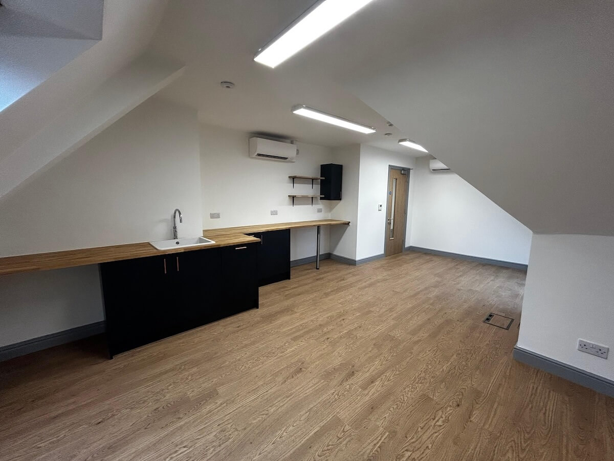 Wide view of working space with ktchen fit out at Warrant House with Cat A and Cat B fit out by Kimpton